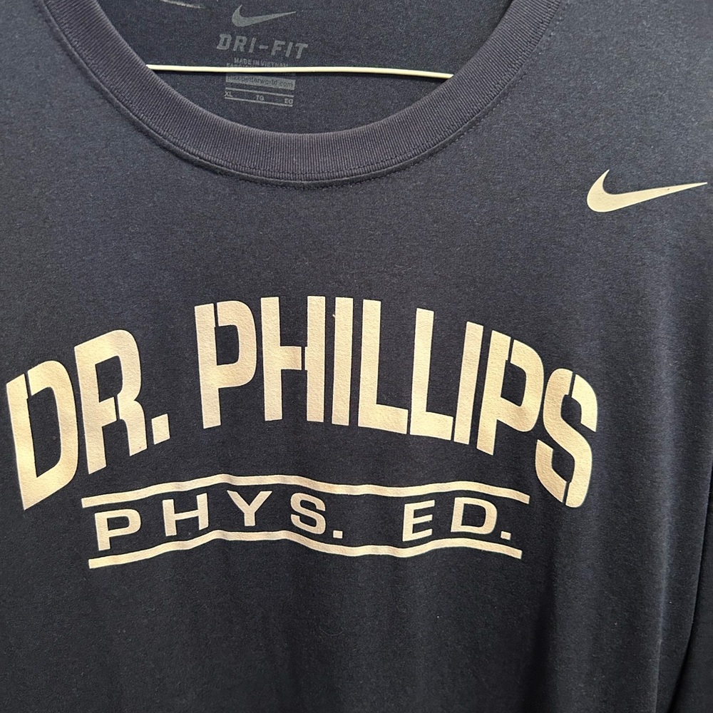 Nike dry-fit long sleeve athletic shirt. Navy blue w white lettering.